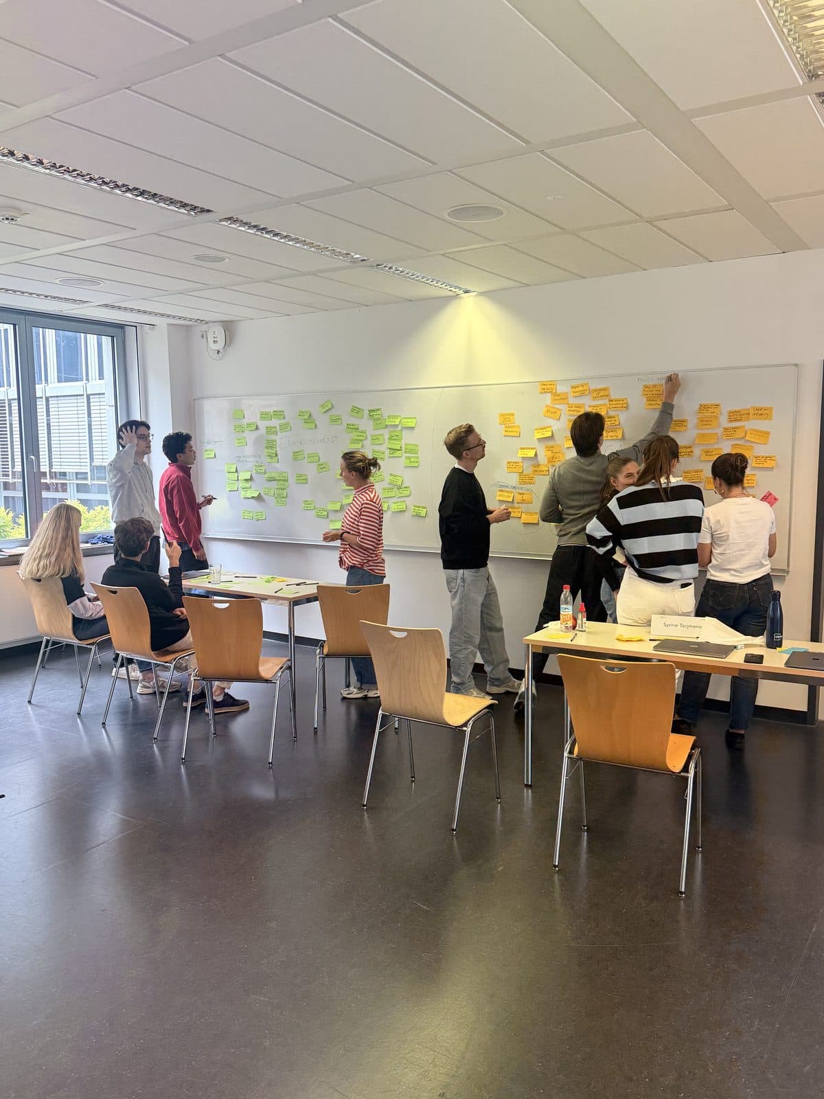 A Trend Seminar class clustering trends on a whiteboard