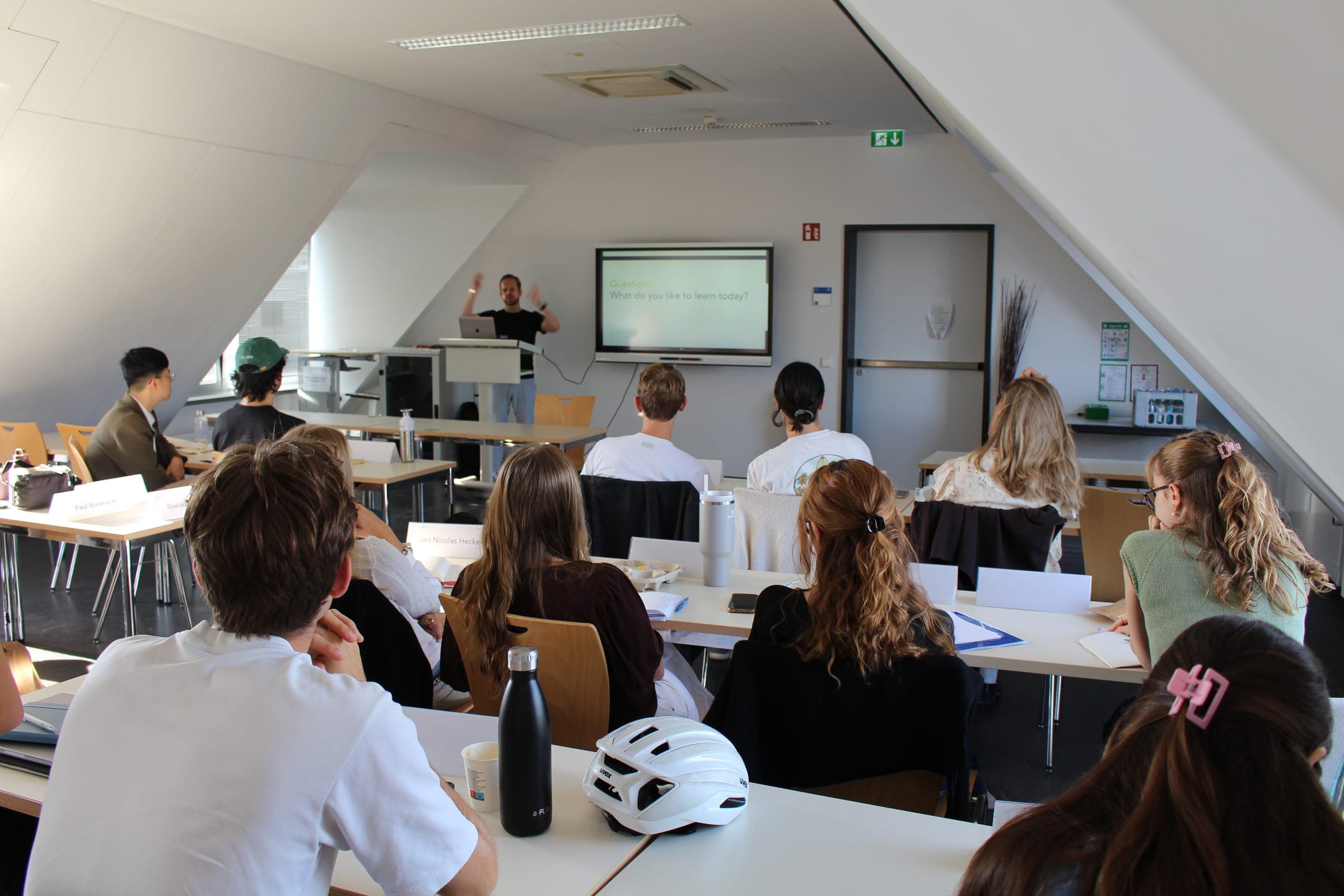 CDTM students in a class at the center, following a session at the front of the room
